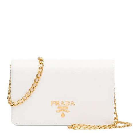 white bag with gold chain
